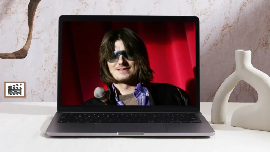 Mitch Hedberg wearing shades and smiling - Where to Watch Mitch Hedberg Documentary?